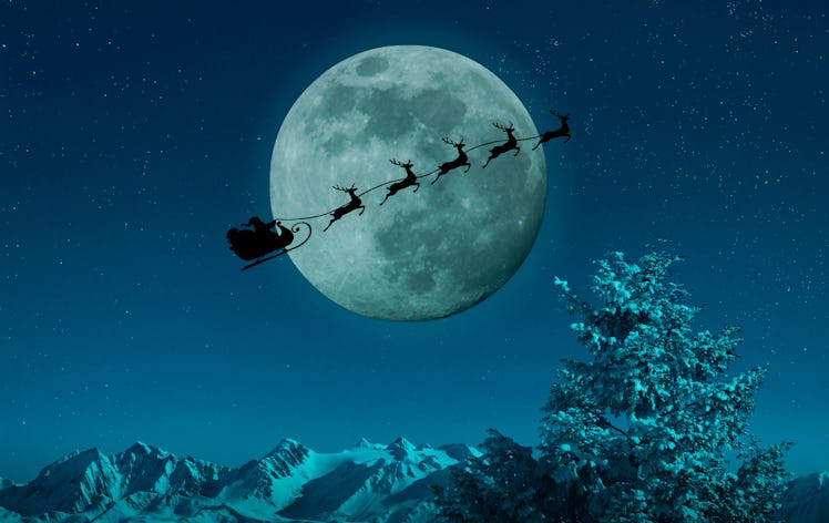 a photo of the December 2023 Cold Full Moon, with an image of Santa and his sleigh overlayed