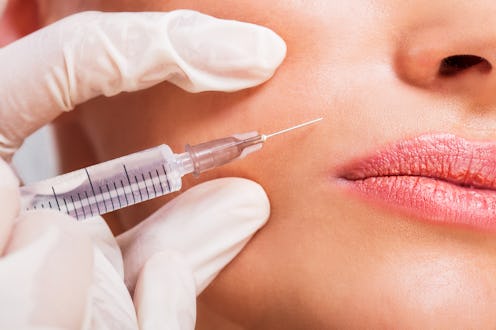 Close up of unrecognizable woman receiving beauty treatment with Botox.