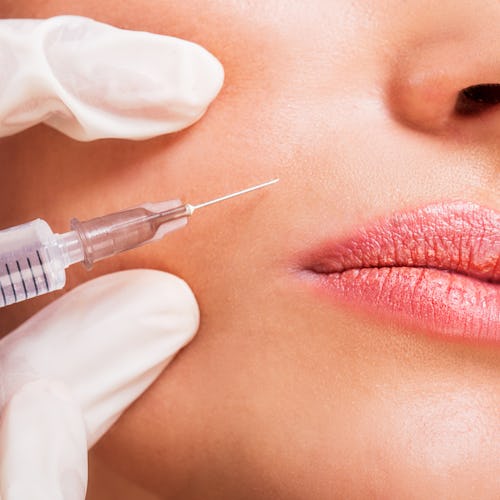 Close up of unrecognizable woman receiving beauty treatment with Botox.