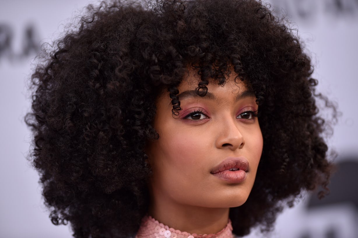 A Complete Wolf Cut Guide For Curly Hair, Straight From Pro Stylists