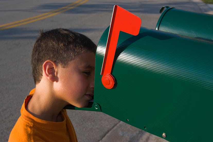 kid looking for postcard from elf in the mail 