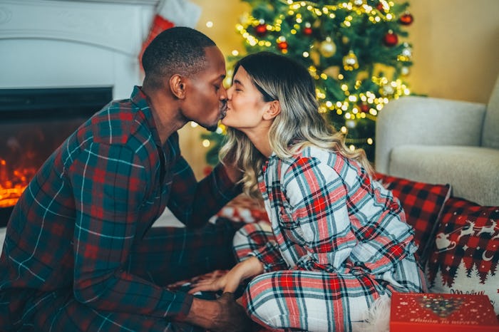 Man surprising his wife with Christmas gift