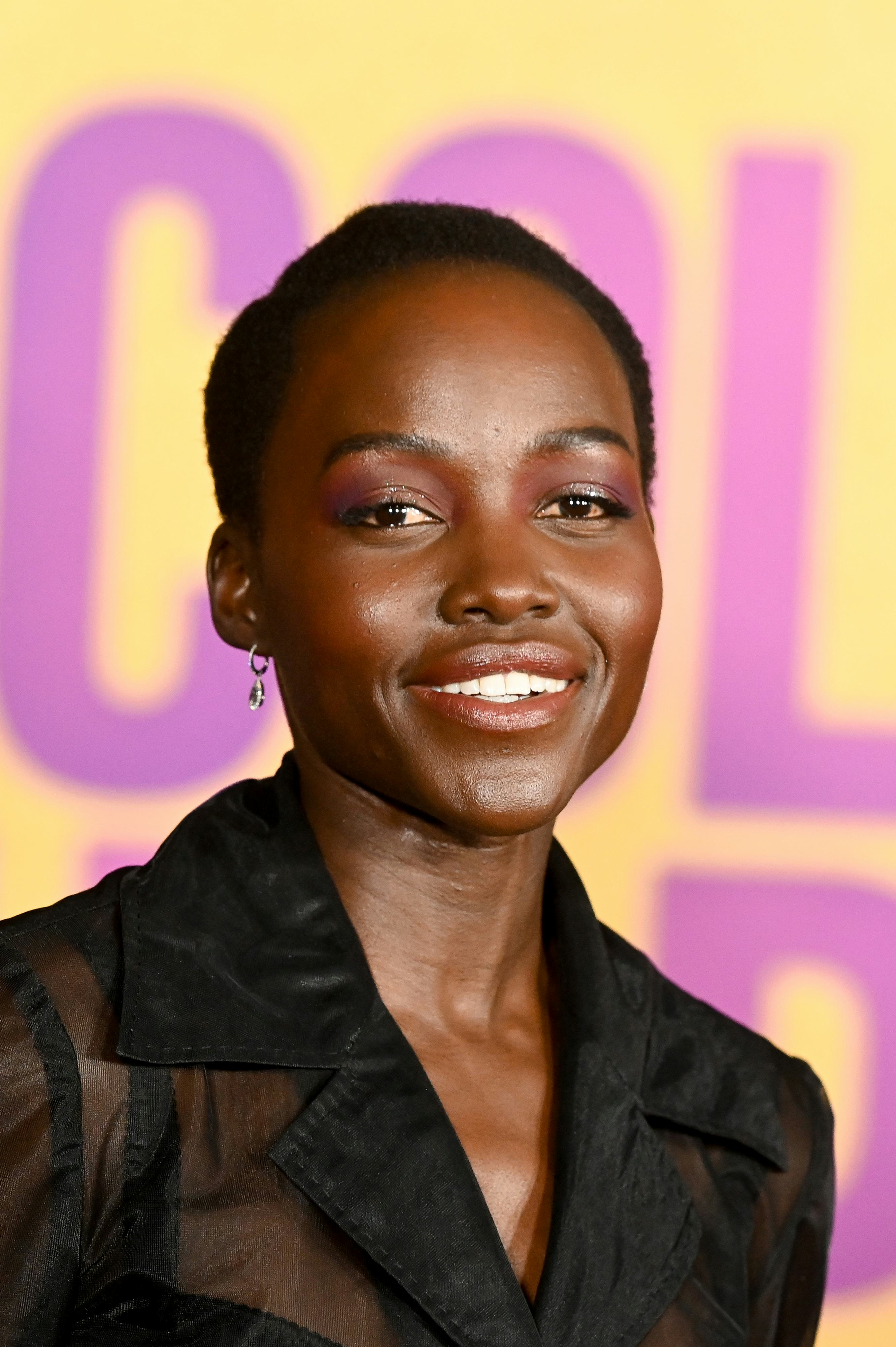 Lupita Nyong&rsquo;o wears a sheer skirt suit set to attend the Los Angeles Premiere of Warner Bros.' &ldquo;The&hellip;