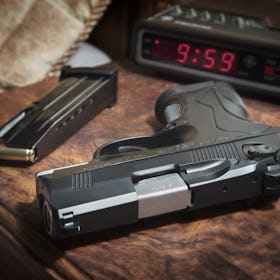 Berreta 9mm PX4 Storm semi-automatic pistol on bedside nightstand