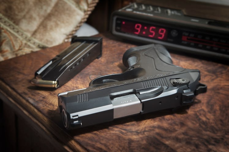 Berreta 9mm PX4 Storm semi-automatic pistol on bedside nightstand