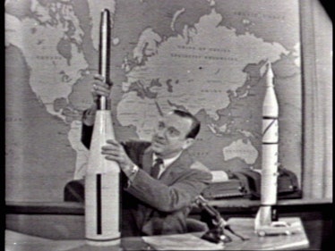 American journalist and anchorman Walter Cronkite uses models to explain America's Explorer 1 missio...