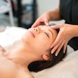a woman getting a facial massage