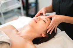 a woman getting a facial massage