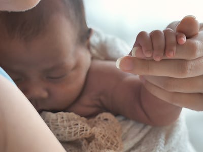 Mother cares for baby, comforting, and support, Asian Newborn 1-month-old at home