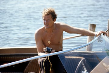 KINGSTON, JAMAICA - MARCH 1: Roger Moore drives a speedboat during the filming of James Bond film 'L...