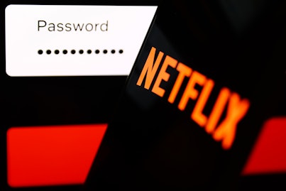 Netflix sign in page displayed on a laptop sscreen and Netflix logo displayed on a phone screen are ...
