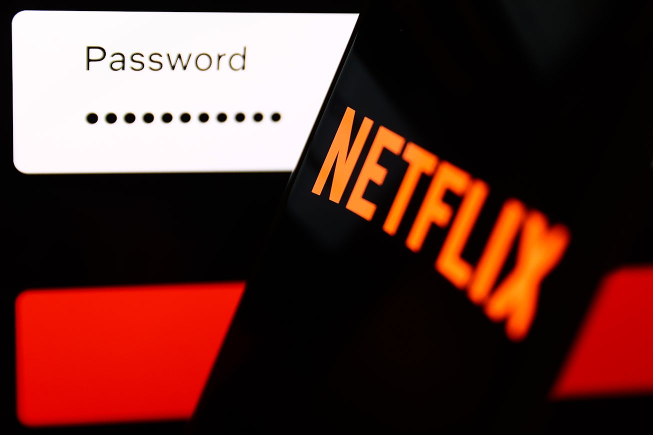 Netflix sign in page displayed on a laptop sscreen and Netflix logo displayed on a phone screen are ...