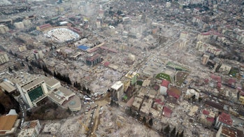 An aerial view of collapsed buildings as search and rescue efforts continue after magnit 7.7 and 7.6...