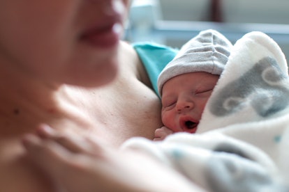 a Newborn baby boy breastfeeding , discharge and breastfeeding