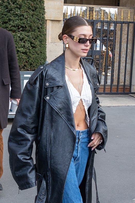 Hailey Baldwin Bieber wore a low, slicked-back bun hairstyle on March 05, 2022 in Paris, France.