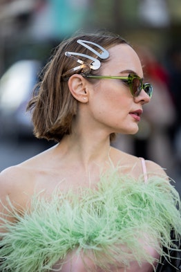 Katya Bychkova wears pink silk dress with green fur collar, over knees boots, mini Dior bag, black v...