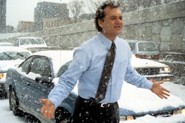 Bill Murray runs through the snow in a scene from the film 'Groundhog Day', 1993. (Photo by Columbia...