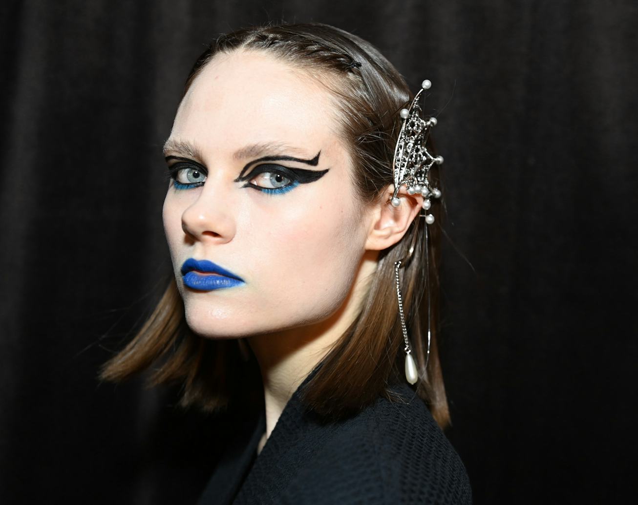 NEW YORK, NEW YORK - FEBRUARY 10: A model is getting prepared backstage for TRESemme X Rodarte on Fe...