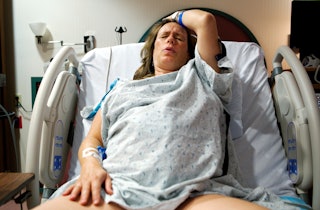 A mother giving birth to her baby in the hospital