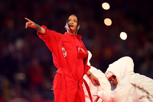 During her Feb. 12 Super Bowl halftime show, fans wondered if Rihanna was pregnant. Photo via Getty ...