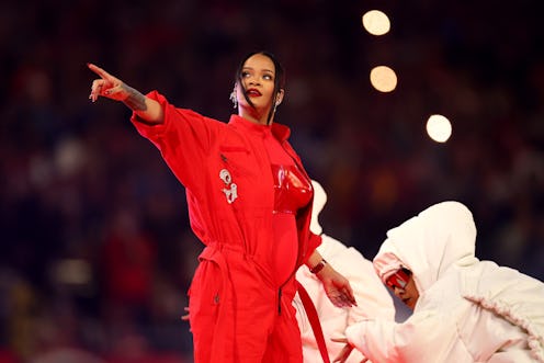 During her Feb. 12 Super Bowl halftime show, fans wondered if Rihanna was pregnant. Photo via Getty ...
