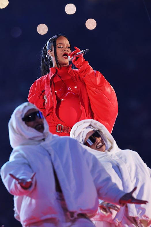 During her Feb. 12 Super Bowl halftime show, fans wondered if Rihanna was pregnant — and she confirm...
