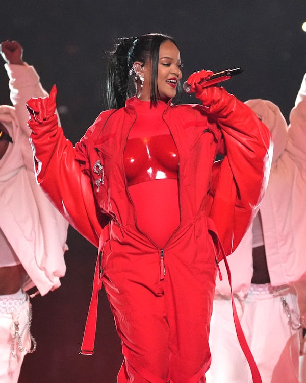 Rihanna wore Fenty Beauty makeup by Priscilla Ono, red CND nail polish, and hair by hairstylist Yuse...