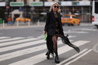 NEW YORK, NEW YORK - FEBRUARY 12: Corina Mihaila Larpin
wearing Peter Do black blazer, Dior black br...
