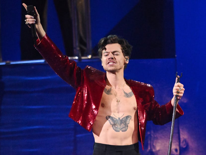 Harry Styles performs live on stage during The BRIT Awards 2023
