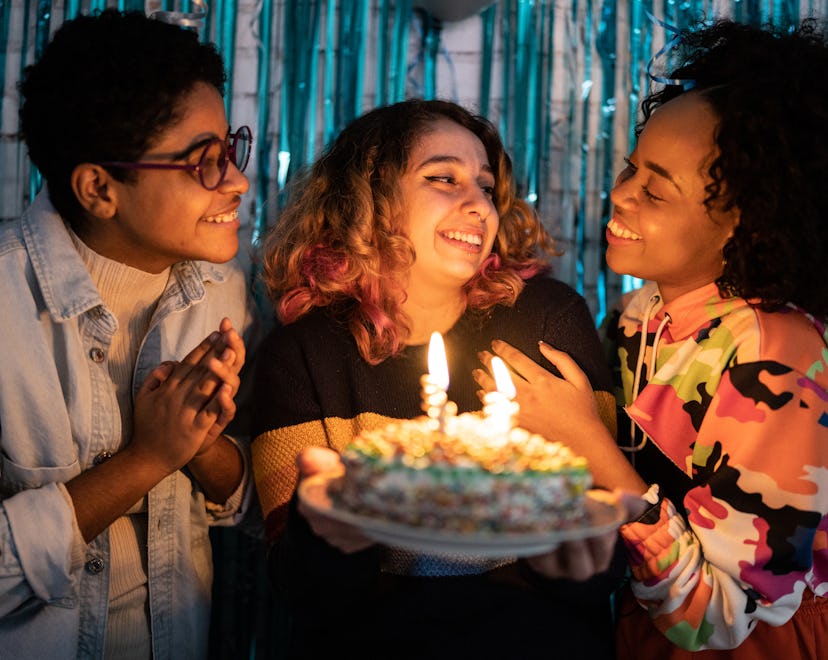 Girls celebrating birthday at home, preparing to post photos with Pisces Instagram captions.