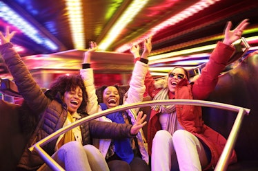 a group of friends enjoys a ride at a theme park as they consider the spiritual meaning of march 20,...