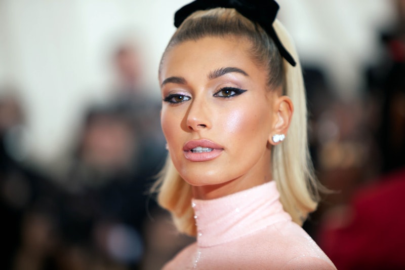 Hailey Bieber wore a spicy red minidress for her Valentine's Day date with Justin Bieber. 