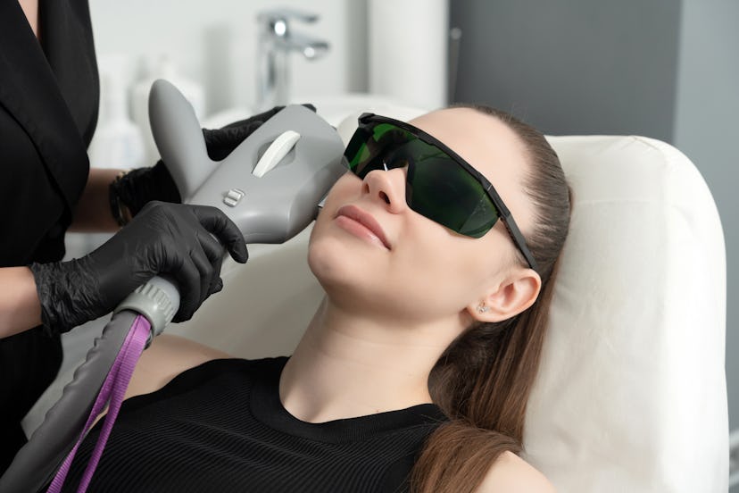Young woman receiving laser treatment