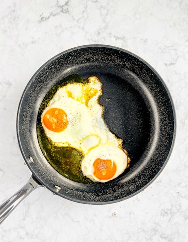 two eggs in a frying pan