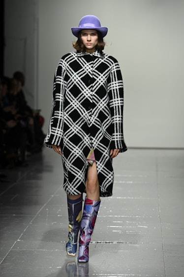 LONDON, ENGLAND - FEBRUARY 17: A model walks the runway at the Conner Ives show during London Fashio...