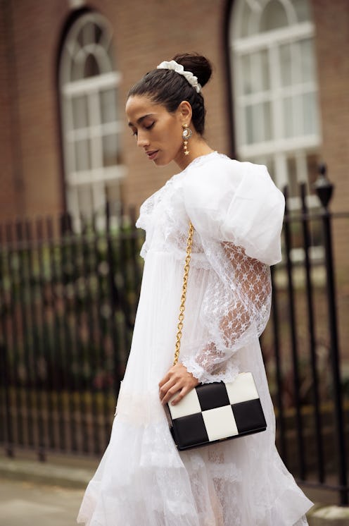 Ciinderella Balthazar wearing long ruffled tulle white and light pink maxi dress with puffy sleaves ...
