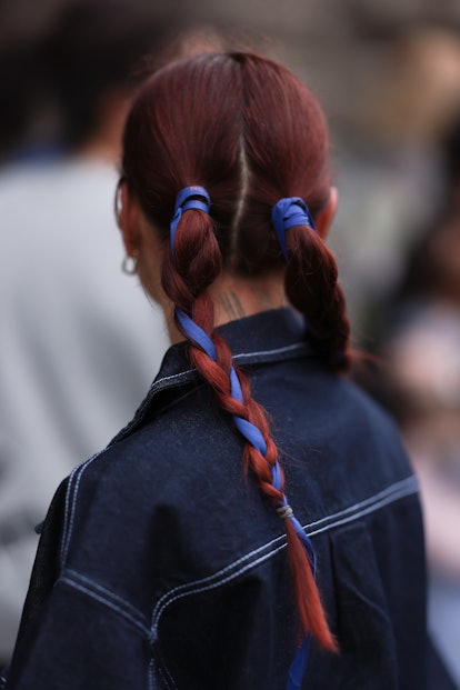 A fashion week guest seen wearing braided plaits, outside simone rocha during London Fashion Week Se...
