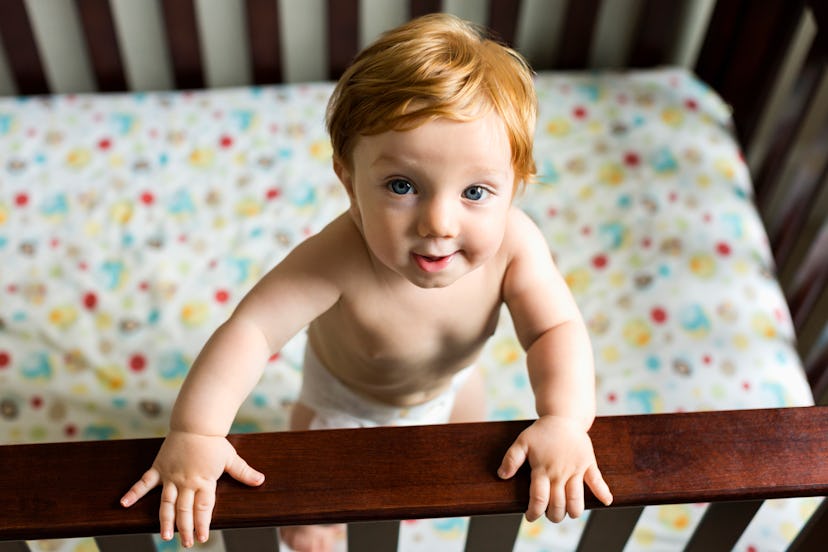 child awake in crib, in an article about the 12 month sleep regression