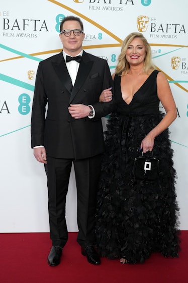 Brendan Fraser and Jeanne Moore attend the EE BAFTA Film Awards 2023