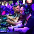 Gaming fans play "Wolfenstein: Youngblood" from Bethesda at the 2019 Electronic Entertainment Expo, ...