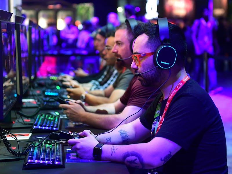 Gaming fans play "Wolfenstein: Youngblood" from Bethesda at the 2019 Electronic Entertainment Expo, ...