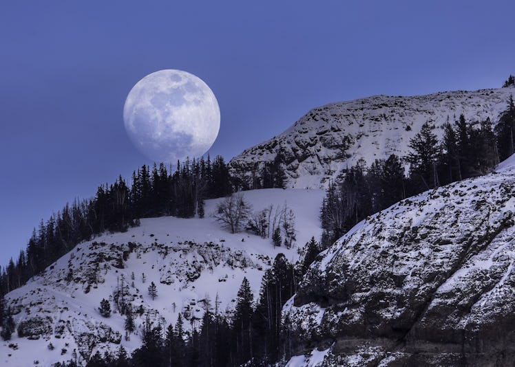 The February 2023 full Snow Moon, with its beautiful spiritual meaning, over Lucker, Northumberland,...