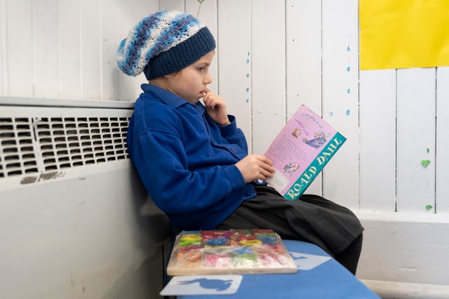 A child reads a Roald Dahl book at Roath Park Primary School on February 23, 2021 in Cardiff, Wales....