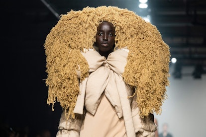 TOPSHOT - A model presents a creation for fashion brand Asai during the catwalk show for their Autum...