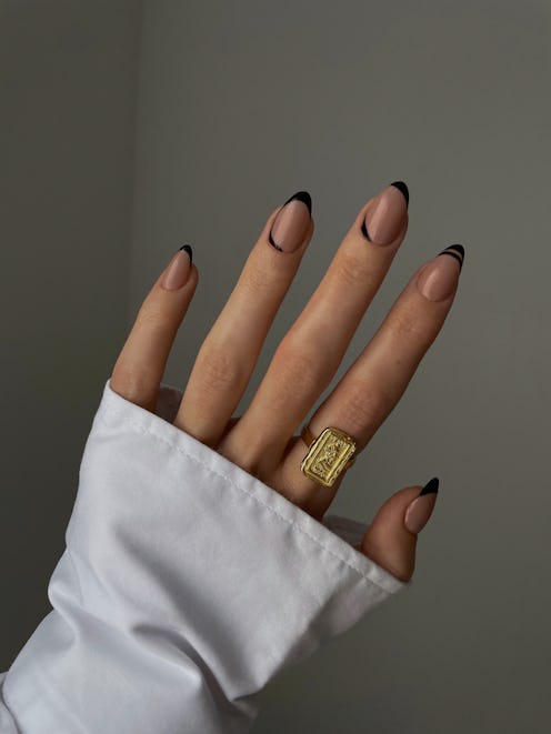 Black micro French tips will be a major spring 2023 nail art trend.