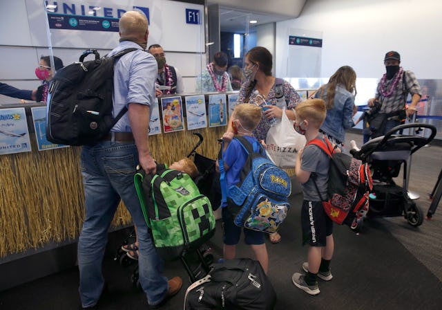 Passengers check-in with United Airlines gate attendants at SFO in San Francisco, Calif. on Thursday...