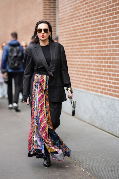 Red lips are a Milan Fashion Week F/W beauty street style trend.