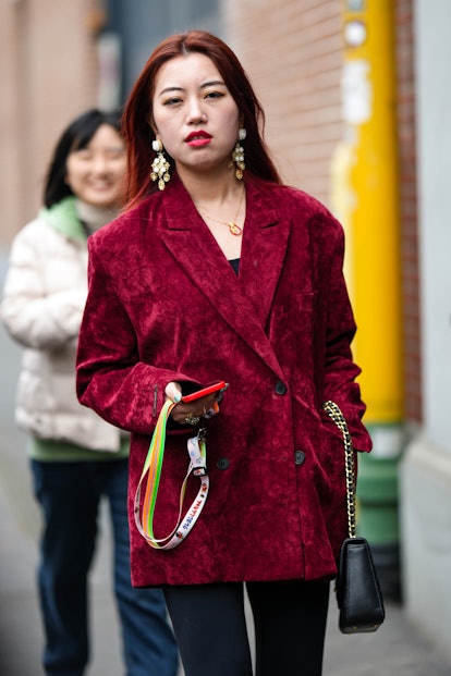 Bold red lips were a popular Milan Fashion Week beauty street style trend.