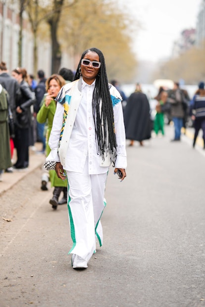 Long braids are a trending street style look at Milan Fashion Week F/W 2023.