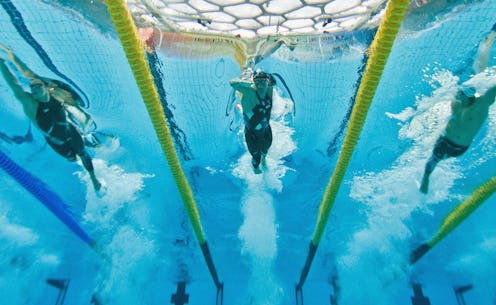 TOPSHOT - This underwater photograph shows US swimmer Michael Phelps (C) South Korea's Park Taehwan ...